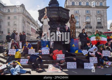 London, UK. 25th March 2023. Iranian and Ukrainian women organised a joint protest in Piccadilly Circus, calling for freedom in Iran and an end to Russian attacks in Ukraine. Stock Photo