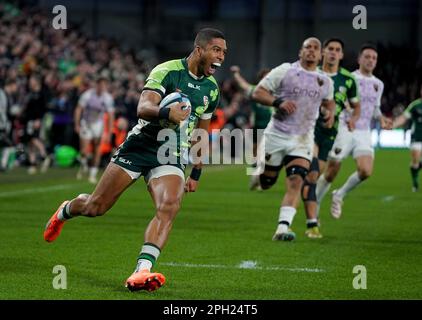London Irish's Ben Loader runs through to score their first try during ...