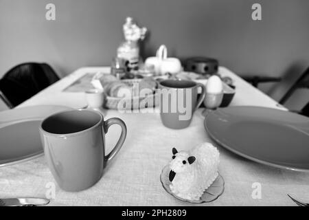 set table with Easter butter lamb prepared for Easter breakfast in Poland, monochrome Stock Photo