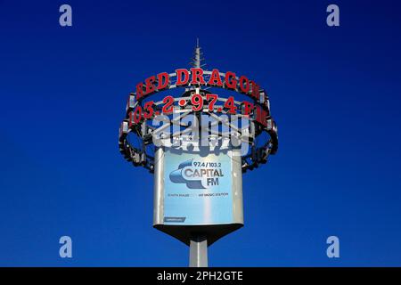 Cardiff Bay-Red Dragon Radio sign against blue sky  Taken March 2023 Stock Photo
