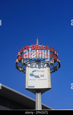 Cardiff Bay-Red Dragon Radio sign against blue sky  Taken March 2023 Stock Photo