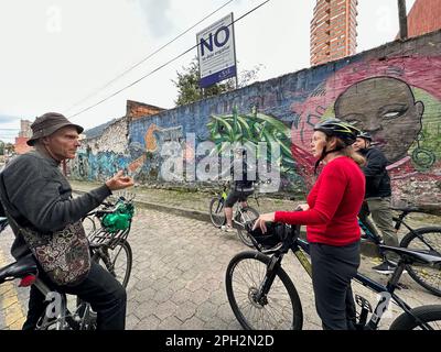 February 16, 2023, BogotÃ, USA: Graffiti or wall art is an important part of modern BogotÃ¡, Colombia. It was legalized following protests after the death of Diego Felipe Becerra, 16, who was shot and killed by police in August 2011 while painting a wall. Tourists on a bike tour of the city view wall art (Credit Image: © Mark Hertzberg/ZUMA Press Wire) EDITORIAL USAGE ONLY! Not for Commercial USAGE! Stock Photo