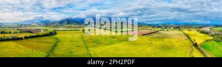 The key farm lands cultivated ship growing agriculture in New Zealand near Brunel peaks mountains. Stock Photo