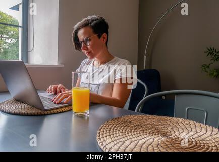 Woman working from home Stock Photo