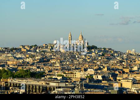 This landscape photo was taken, in Europe, in France, in ile de France, in Paris, in summer. We see the Basilica of the Sacred Heart on the Montmartre Stock Photo