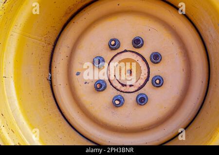 Detail of bolts on the rim of a backhoe wheel Stock Photo