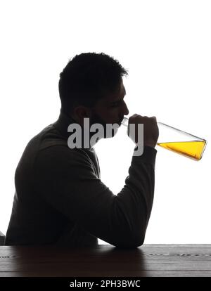 Silhouette of addicted man drinking alcohol on white background Stock Photo