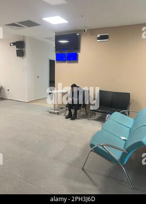 Earthquake survivor man waiting for doctor in hospital. Stock Photo