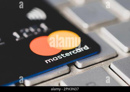 March 26, 2021. Close-up of a mastercard card on the gray keyboard Stock Photo