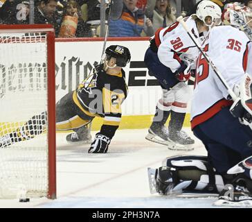 Pittsburgh, United States. 25th Mar, 2023. Pittsburgh Penguins center Ryan Poehling (25) scores against the Washington Capitals goaltender Darcy Kuemper (35) during the second period at PPG Paints Arena in Pittsburgh on Saturday, March 25, 2023. Photo by Archie Carpenter/UPI Credit: UPI/Alamy Live News Stock Photo