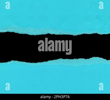 Torn blue paper with space for your message on black background Stock Photo