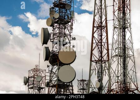 telecommunication mast TV antennas wireless technology with cloudy  blue sky in Brazil Stock Photo