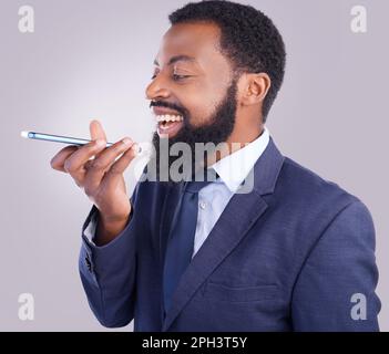 Phone, voice message and man in white background, studio and talking for business contact. Happy corporate, black male and mobile recording for Stock Photo