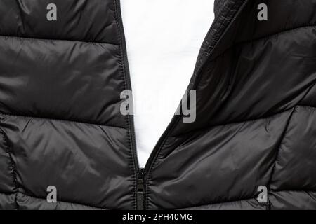 Unzipped winter black jacket with white empty space Stock Photo