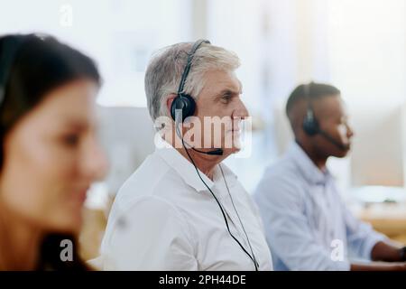 All our agents are experts in the field. agents working in a call centre. Stock Photo