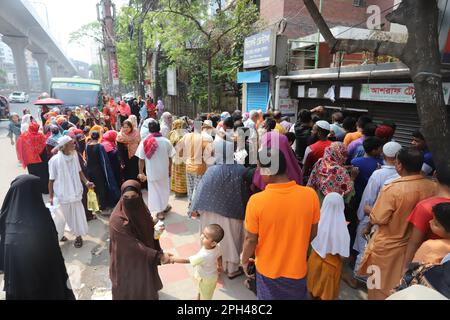 Bangladesh Trading Corporation sells necessary food products at subsidised prices. People crowd a TCB shop to buy goods early morning. Stock Photo