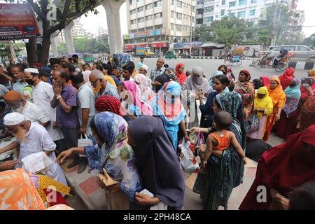 Bangladesh Trading Corporation sells necessary food products at subsidised prices. People crowd a TCB shop to buy goods early morning. Stock Photo