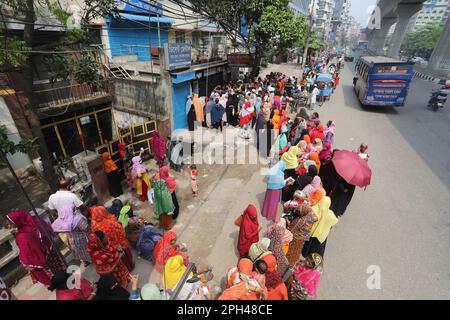 Bangladesh Trading Corporation sells necessary food products at subsidised prices. People crowd a TCB shop to buy goods early morning. Stock Photo