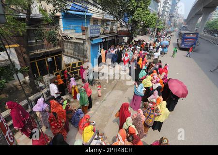 Bangladesh Trading Corporation sells necessary food products at subsidised prices. People crowd a TCB shop to buy goods early morning. Stock Photo