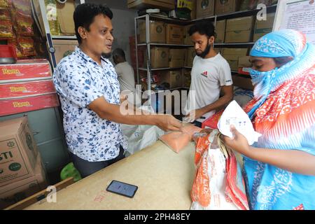 Bangladesh Trading Corporation sells necessary food products at subsidised prices. People crowd a TCB shop to buy goods early morning. Stock Photo