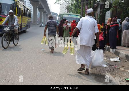 Bangladesh Trading Corporation sells necessary food products at subsidised prices. People crowd a TCB shop to buy goods early morning. Stock Photo