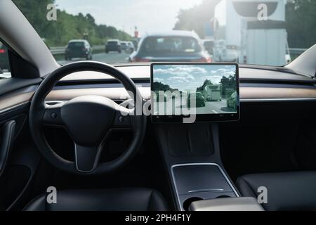 Self driving car on a road. Autonomous vehicle. Inside view. Stock Photo