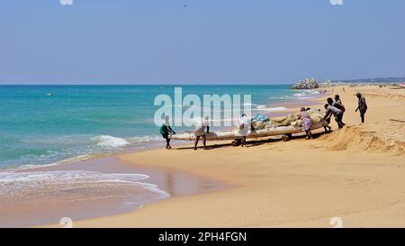 Kanyakumari,Tamilnadu,India- December 28 2021: Tamilnadu fishermen getting their wooden boat or catamaran for fishing in Bay of Bengal. Stock Photo