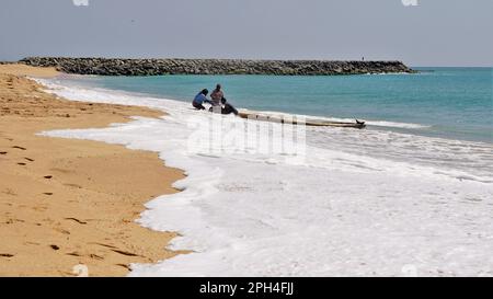 Kanyakumari,Tamilnadu,India- December 28 2021: Tamilnadu fishermen getting their wooden boat or catamaran for fishing in Bay of Bengal. Stock Photo