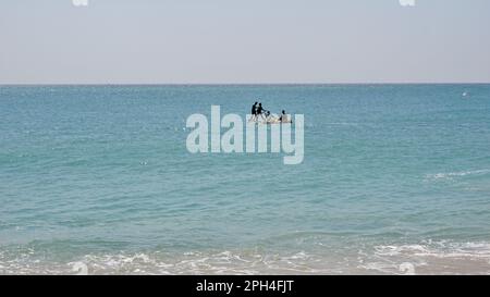 Kanyakumari,Tamilnadu,India- December 28 2021: Tamilnadu fishermen getting their wooden boat or catamaran for fishing in Bay of Bengal. Stock Photo