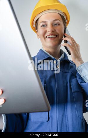 Woman engineer with digital tablet and smartphone. High quality photo Stock Photo