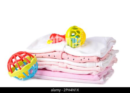 Baby clothes with rattle isolated on white background, top view Stock Photo