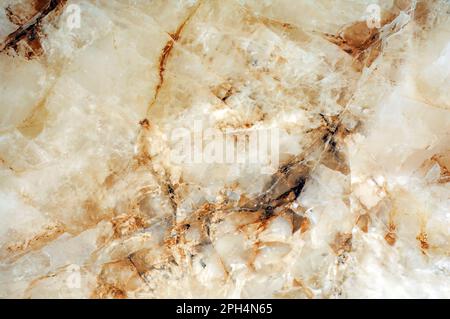 Rusty texture of light marble, imitation of Spanish natural stone. Warm abstract background. Stock Photo