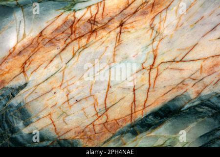 natural stone texture, michelangelo quartzite slab, greenish gray color with rust spots and milky white spots, various cracks. Stock Photo