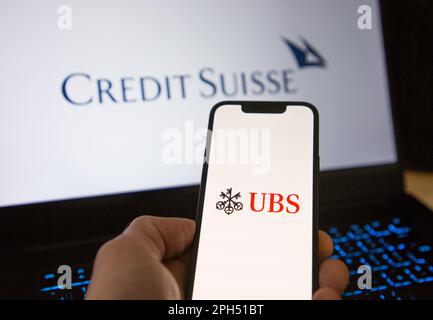 UBS Bank mobile banking app in front of the Credit Suisse website Stock Photo