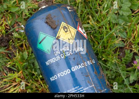 Wexham, Buckinghamshire, UK. 26th March, 2023. Nitrous Oxide Cream Chargers abandoned along a country lane. The Government are to ban the use or possession of nitrous oxide known as laughing gas in public from next week. Nitrous Oxide also known as hippy crack is used in catering, however, it has become very popular with some young people as a recreational drug and can cause death when it is inhaled. Credit: Maureen McLean/Alamy Live News Stock Photo