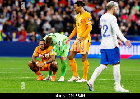 Memphis Depay of the Netherlands, Jasper Cillessen of the Netherlands and Virgil van Dijk of the Netherlands look dejected during the UEFA Euro 2024, European Qualifiers, Group B football match between France and Netherlands on March 24, 2023 at Stade de France in Saint-Denis near Paris, France - Photo: Marcel Ter Bals/DPPI/LiveMedia Stock Photo