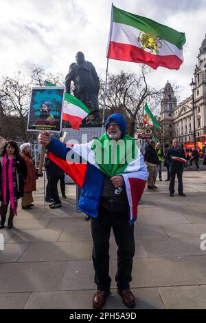 Schoolgirls in danger of poisoning placard, Iranian  pro-democracy protest against the autocratic Islamist government of Iran at Parliament Square in Stock Photo