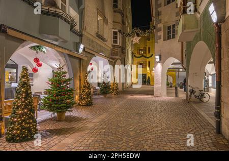 The colorful Bressanone old town during Christmas time in the evening, Trentino Alto Adige, northern Italy. Stock Photo