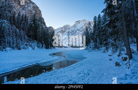 A cold winter morning at a snowy and iced Lake Braies, Province of Bolzano, Trentino Alto Adige, Italy. Stock Photo