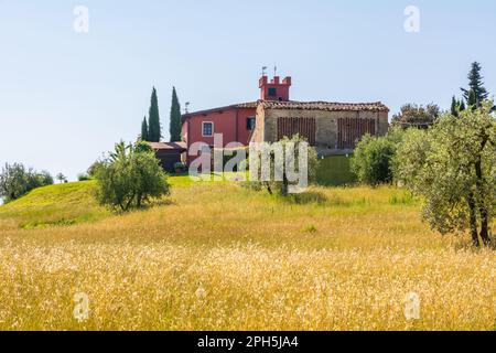 Baked brick half-timbered barn on farms in Tuscany region, near Gambassi Terme, Firenze province,central Italy with window made of herringbone tiles f Stock Photo