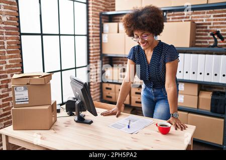 African american woman ecommerce business worker using coputer at office Stock Photo