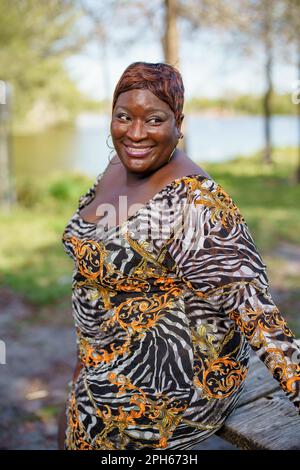 Stock photo beautiful BBW plus sized model posing in the park