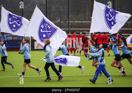 Nijmegen, Netherlands. 26th Mar, 2023. NIJMEGEN, NETHERLANDS - MARCH 26: Flagrunners of NMHC during the Promotieklasse Hockey match between NMHC Nijmegen H1 and LMHC Laren H1 at the Sportpark d'Almarasweg on March 26, 2023 in Nijmegen, Netherlands (Photo by John Beckmann/Orange Pictures) Credit: Orange Pics BV/Alamy Live News Stock Photo