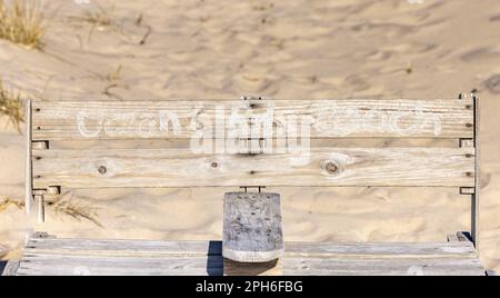 Handmade wooden bench with Ocean Rd Beach painted by hand on the back Stock Photo