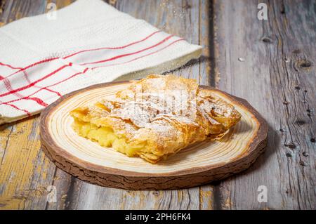 Greek pastry Bougatsa with phyllo dough and semolina custard cream. Stock Photo