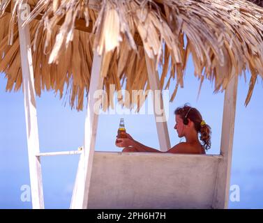 Young woman relaxing, Pigeon Point Lookout, Tobago, Trinidad & Tobago, Lesser Antilles, Caribbean Stock Photo