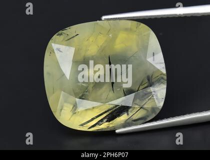 Natural gem green prehnite on gray background Stock Photo