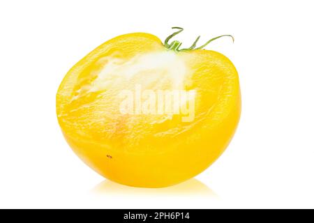 Fresh sliced yellow tomato  Isolated on white background. Diet food. File contains clipping path. Stock Photo