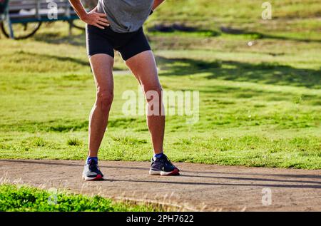 Senior Woman Jogger taking a break Stock Photo