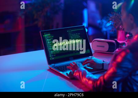 Seen from behind modern female with laptop and vr headset developing ai software in modern office. Stock Photo